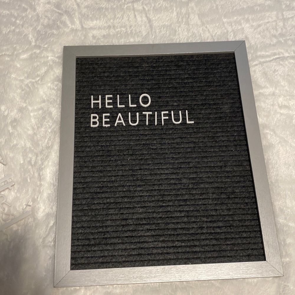 Felt letter board with letters, numbers, and symbols.